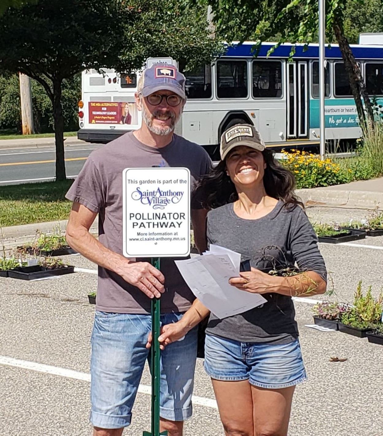 Pollinator Plant Giveaway 2018-residents with their pollinator sign